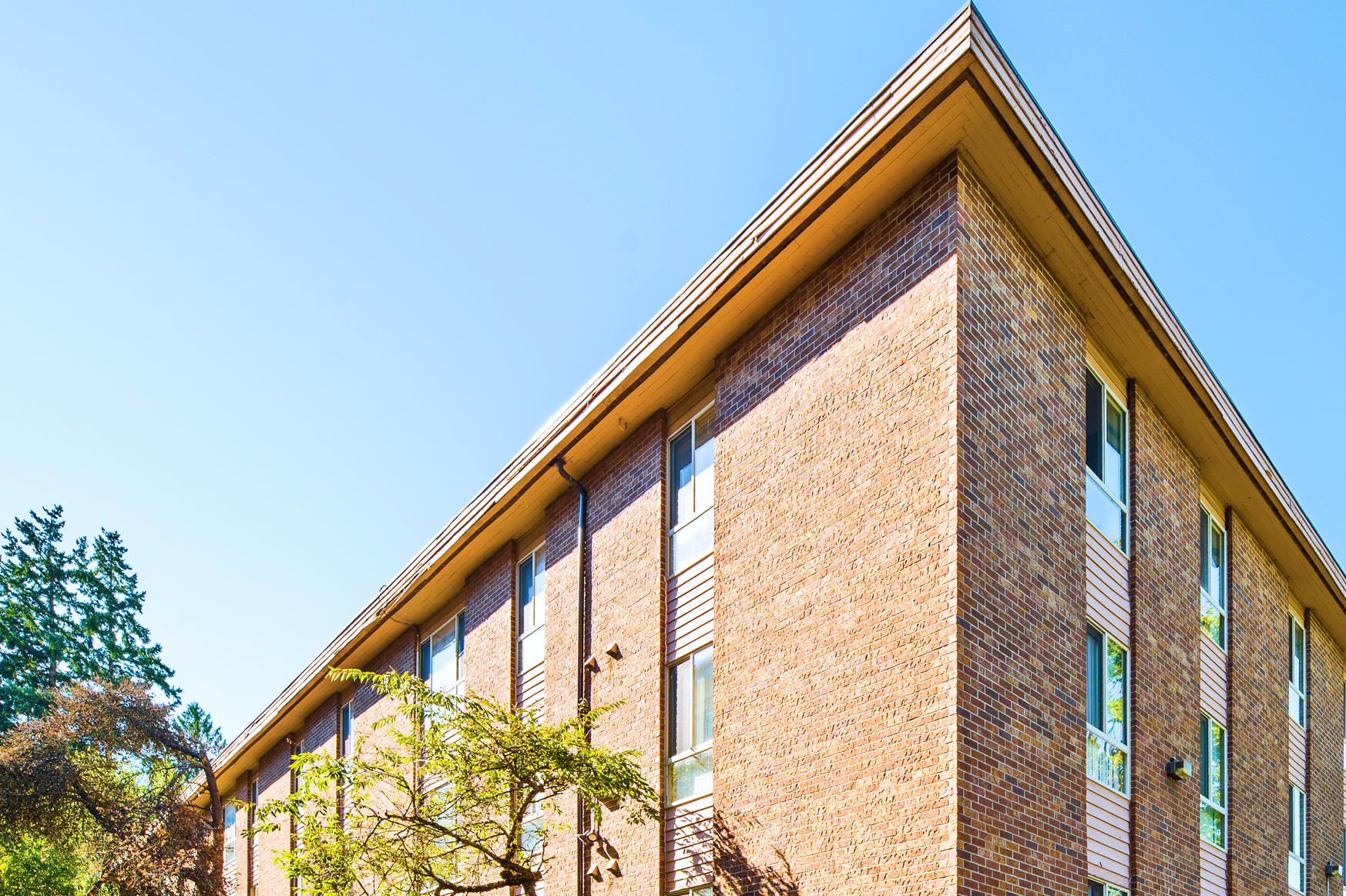 White Heather Apartments, exterior corner against a clear sky